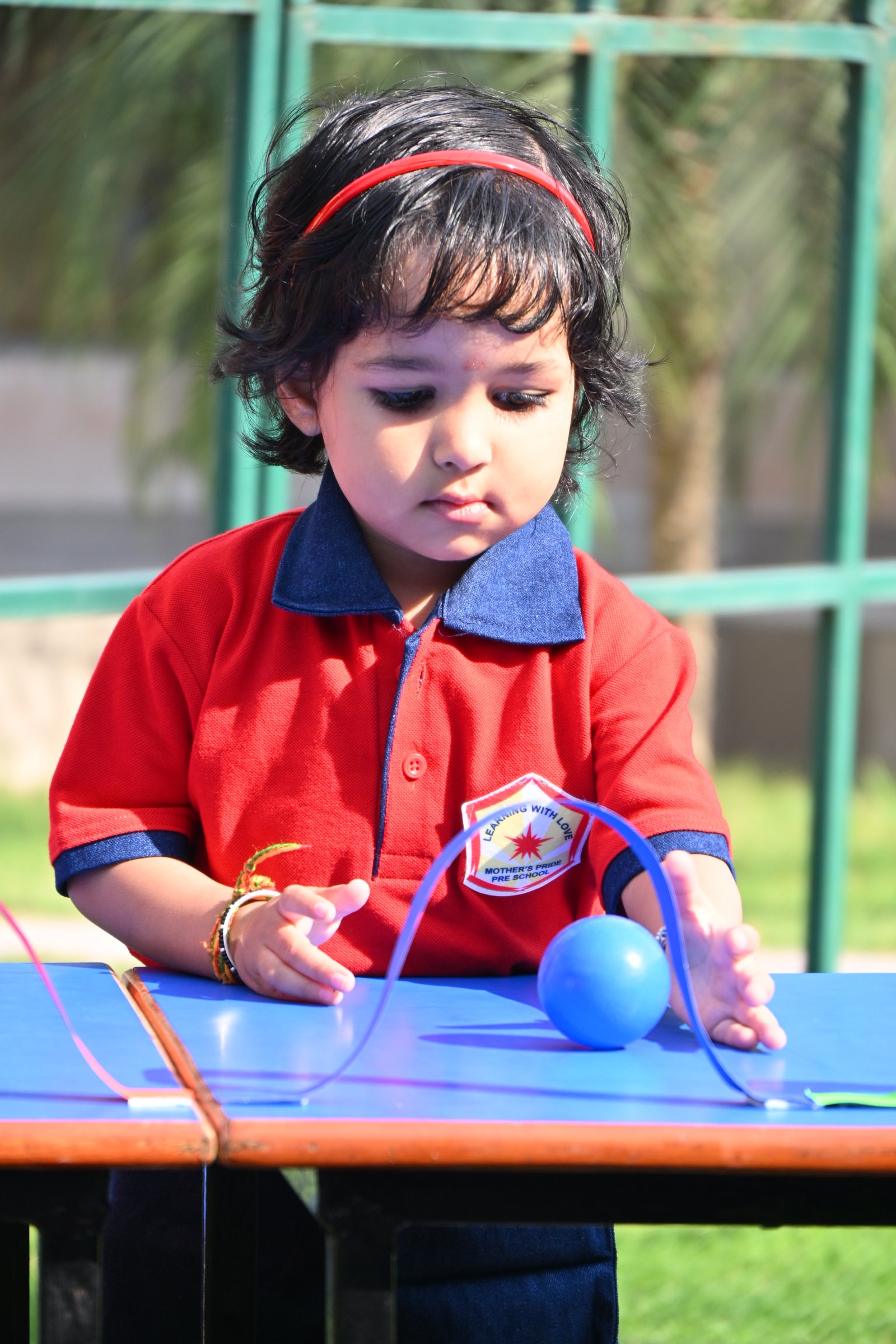 Children wearing uniforms in class